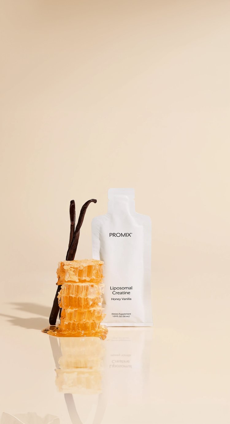A pouch of Promix Liposomal Creatine beside stacked honeycomb and vanilla pods