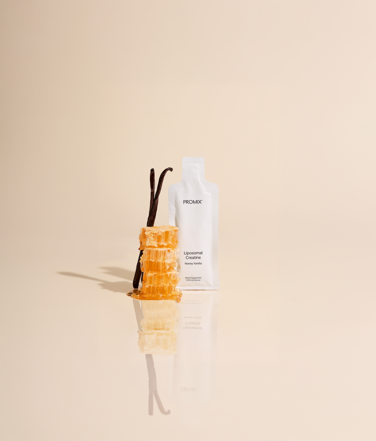 Promix Liposomal Vitamin C bottle held in hand with orange slices